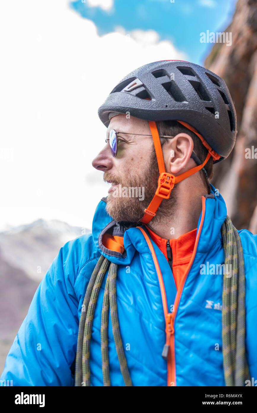 Face expressions while a climber climb a big wall inside the Andes, an