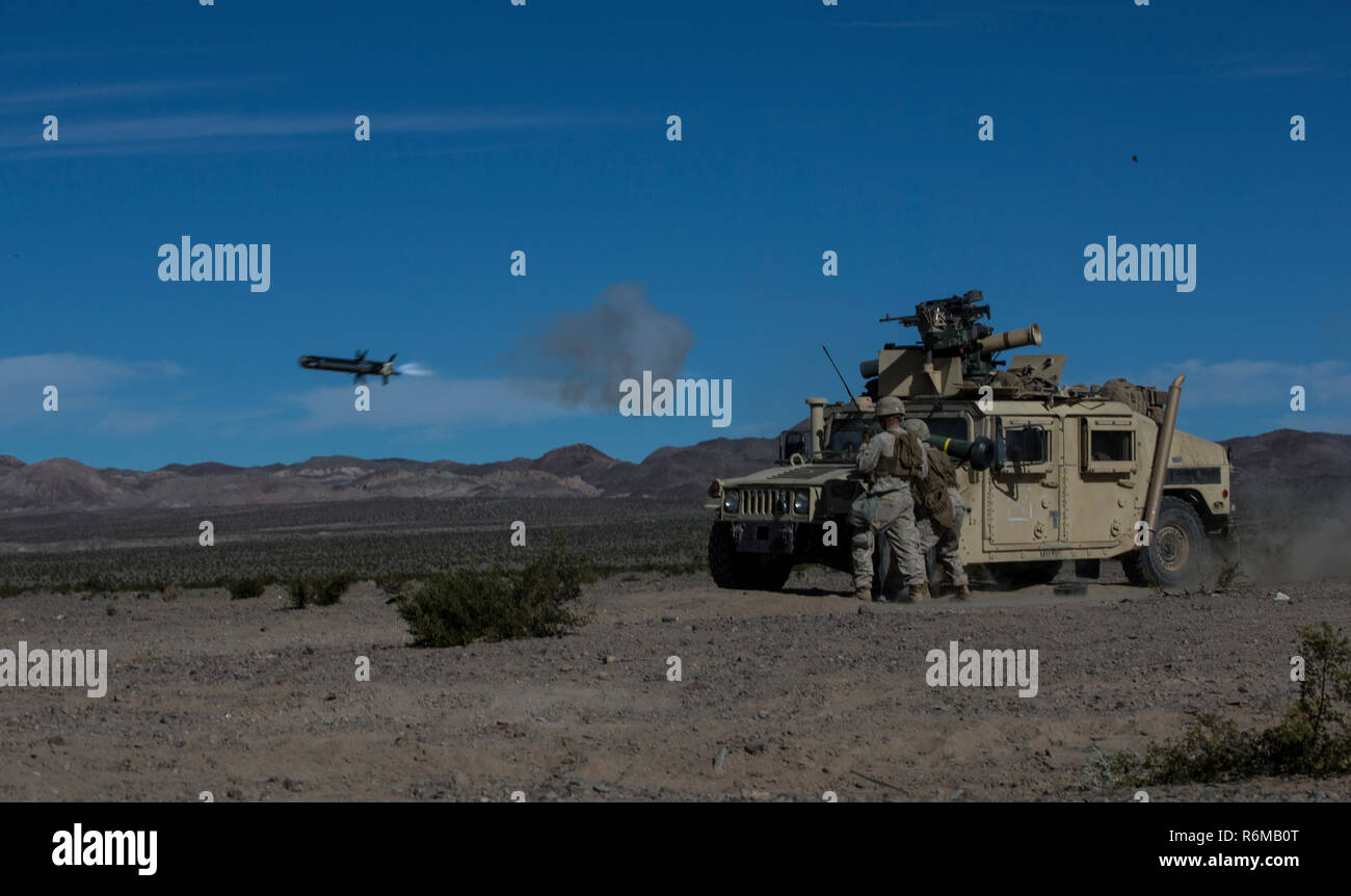 U.S. Marine Corps Cpl. Joseph Magee, left, and Cpl. Andy E. Coussens, with combined anti-armored team, 2nd Battalion, 7th Marine Regiment, 1st Marine Division, fires a tow missile, during exercise Steel Knight (SK) 2019 at Marine Corps Air Ground Combat Center, Twentynine Palms, California, Dec. 4, 2018. SK is an annual exercise used to enhance the Marines' and Sailors' skills, tactics, and combat readiness by performing in various dynamic scenarios, ground combat maneuver operations, and live fire ranges. (U.S. Marine Corps photo by Cpl. Robert G. Gavaldon) Stock Photo