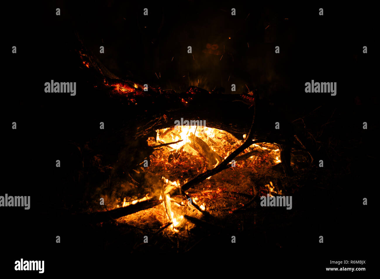 Flame fire texture black orange red gold golden yellow blaze flames flaming blazing burning on black background Stock Photo