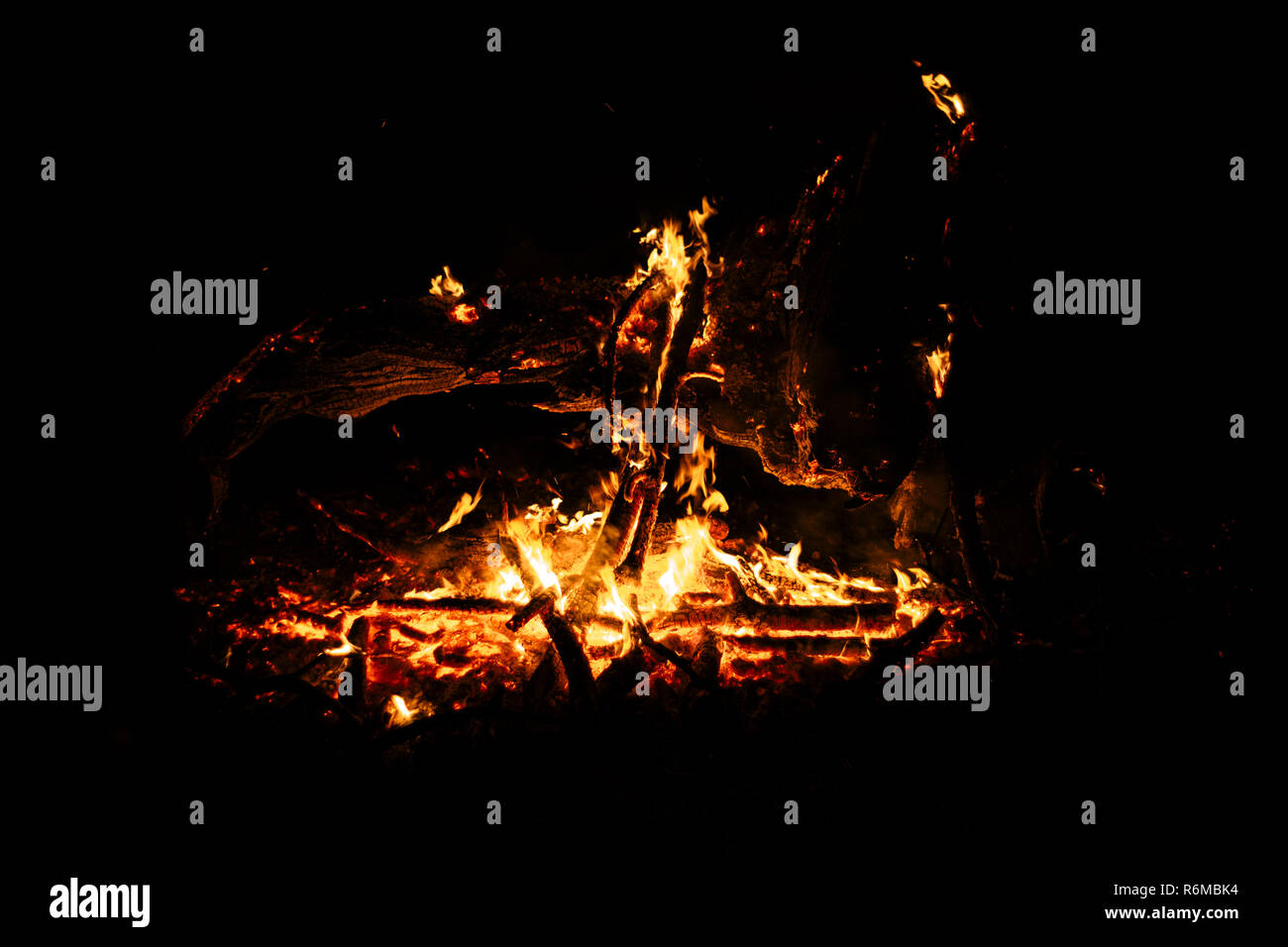 Flame fire texture black orange red gold golden yellow blaze flames flaming blazing burning on black background Stock Photo