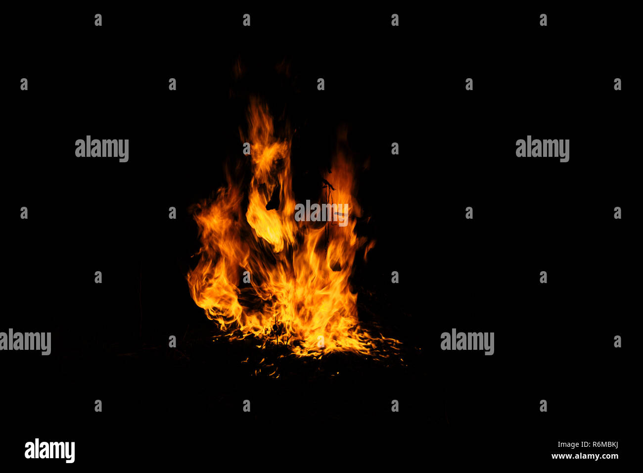 Flame fire texture black orange red gold golden yellow blaze flames flaming blazing burning on black background Stock Photo