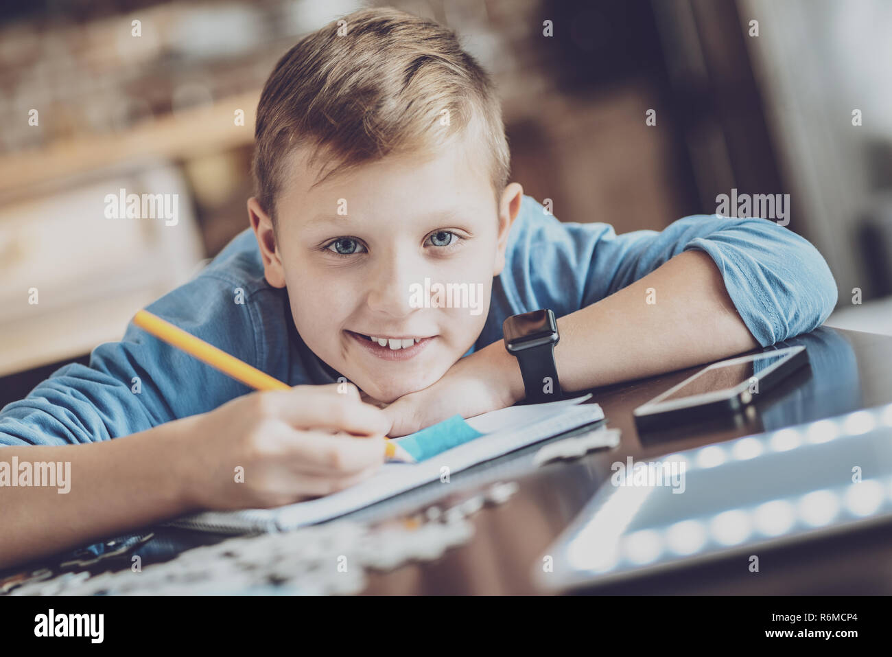Portrait of happy pupil that posing on camera Stock Photo