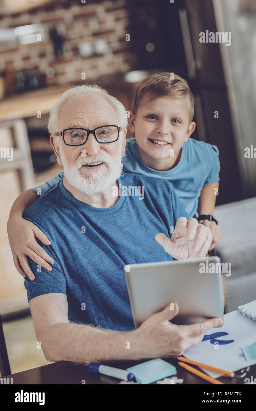 Happy males looking straight at camera Stock Photo - Alamy