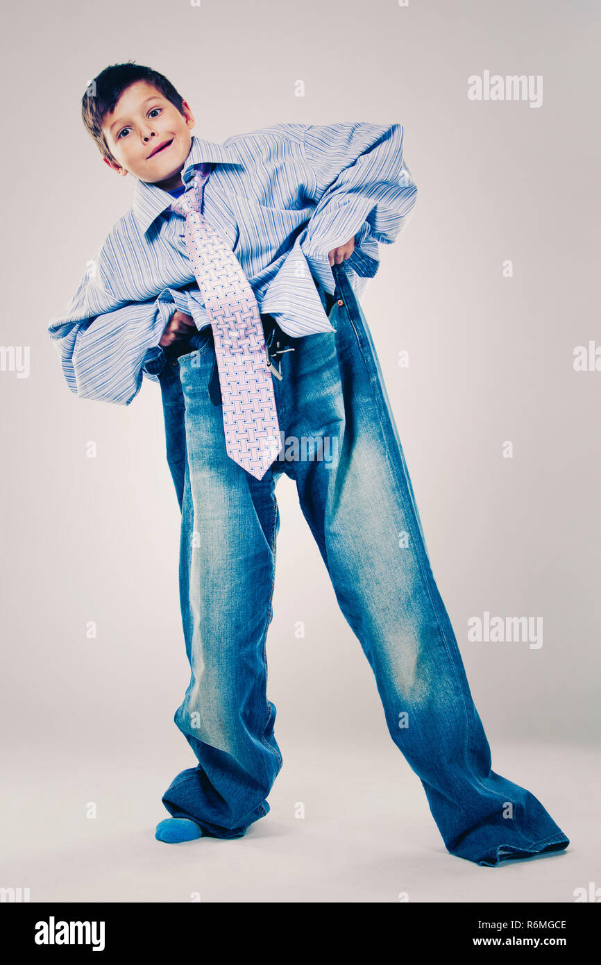 funny boy wearing Dad's clothes Stock Photo Alamy