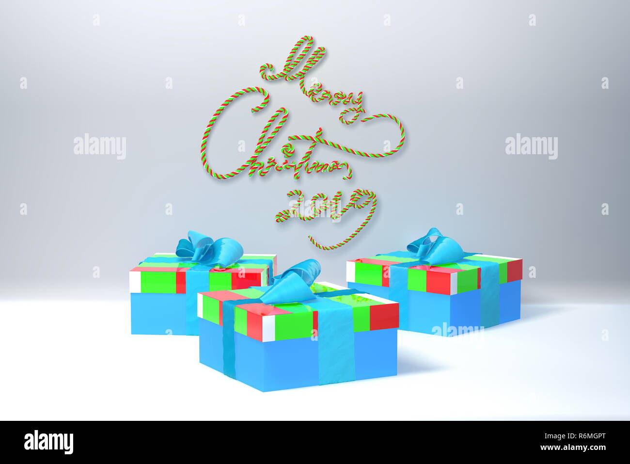 Merry Christmas 2019 lettering written by ribbon on white wall and three present gift boxes with bows beside. 3d illustration Stock Photo