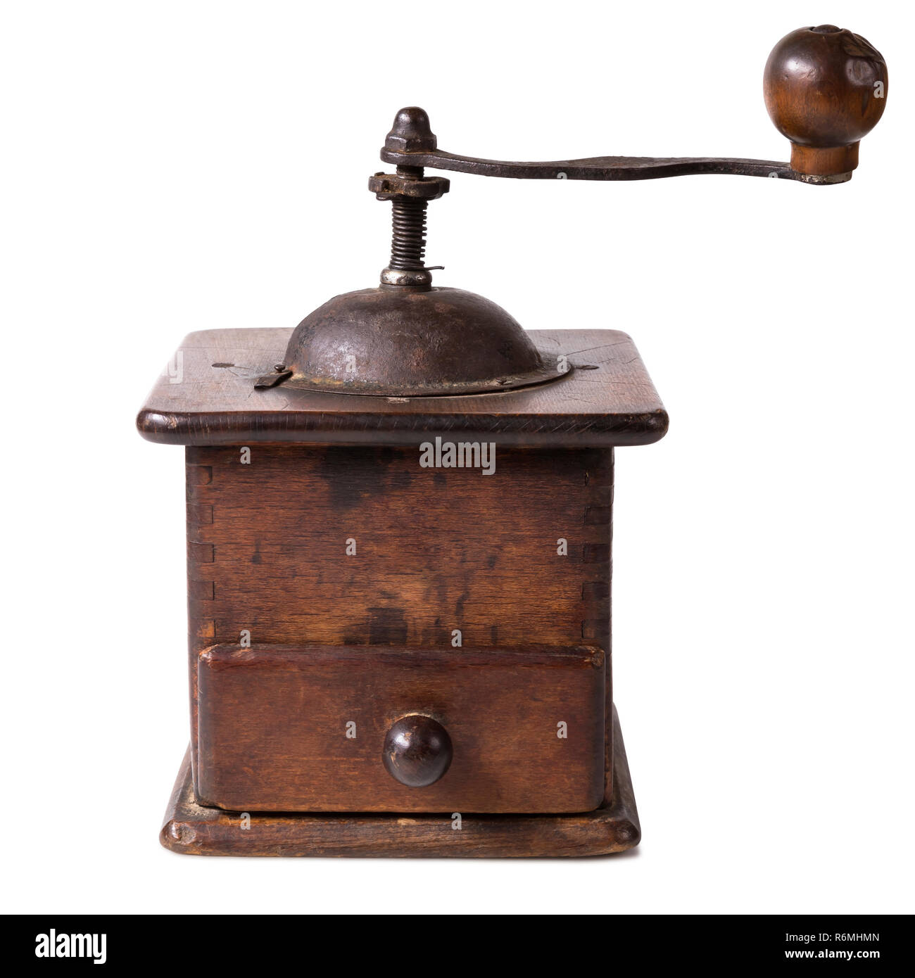 Old wooden coffee grinder with closed drawer. Isolated on white
