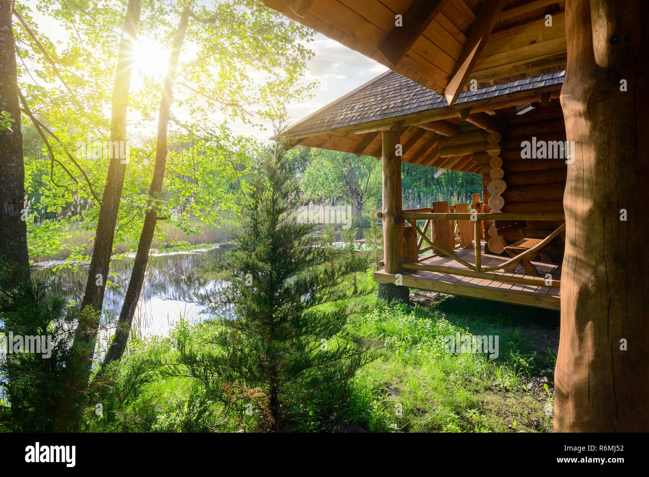Wooden house and river Stock Photo - Alamy