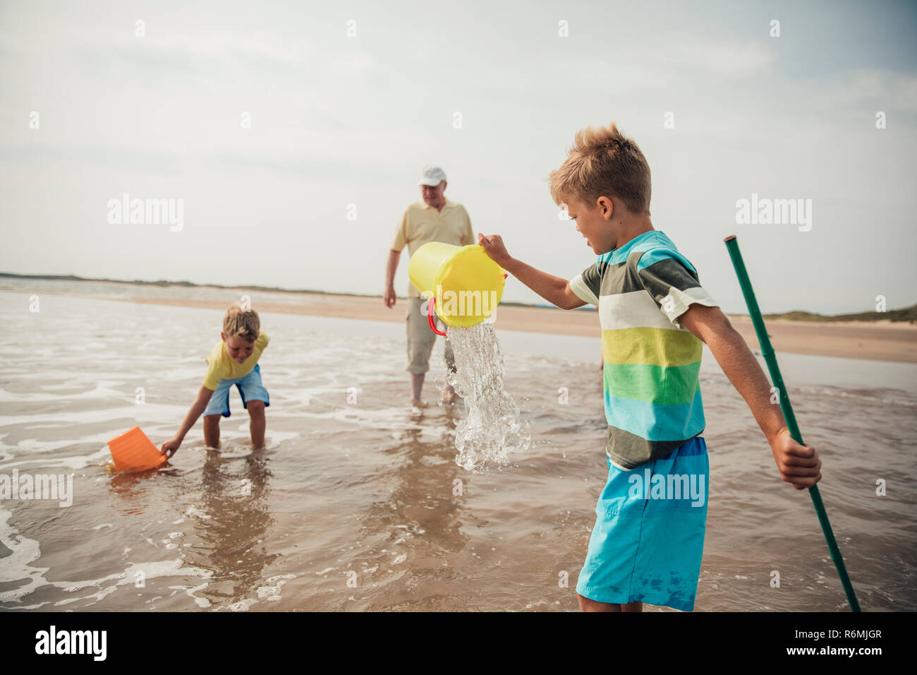 Little Boys Playing in the Sea Stock Photo - Alamy