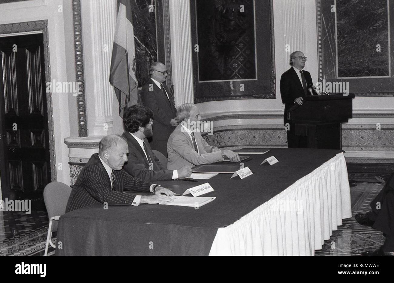 A MAN AT THE PODIUM GIVING A SPEECH TO A GROUP OF PEOPLE Stock Photo ...
