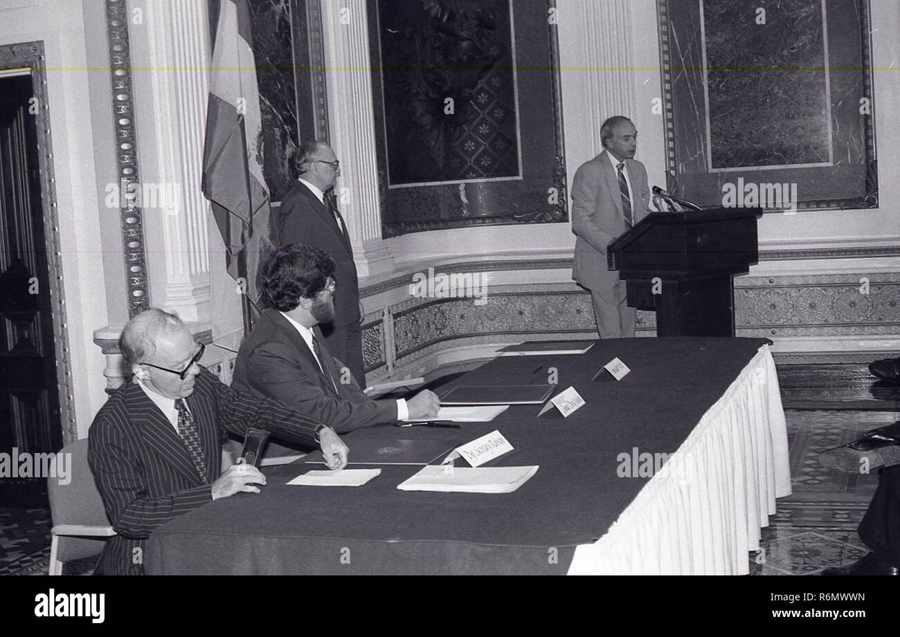 A MAN AT THE PODIUM GIVING A SPEECH TO A GROUP OF PEOPLE Stock Photo ...