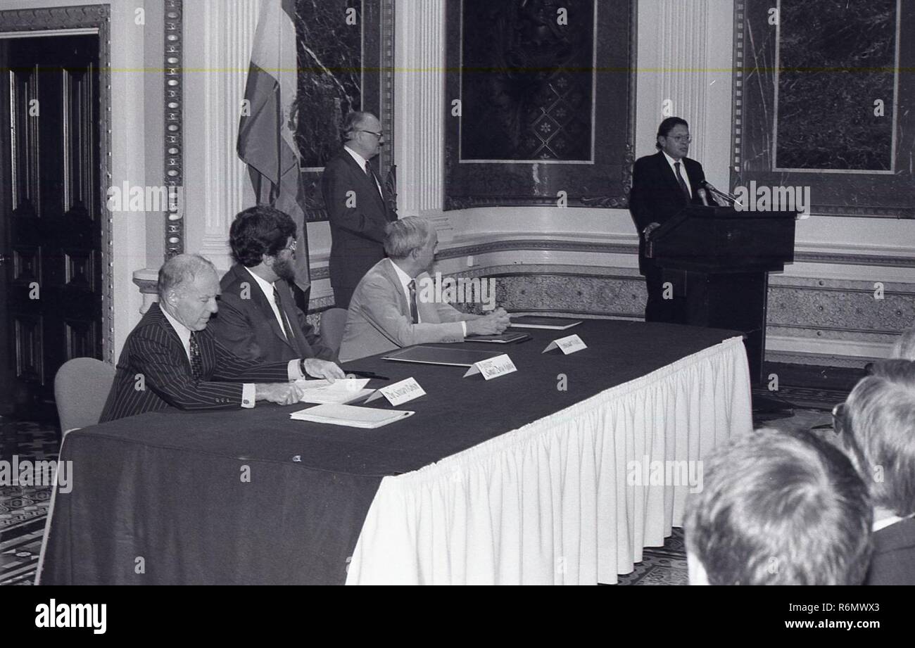 A MAN AT THE PODIUM GIVING A SPEECH TO A GROUP OF PEOPLE Stock Photo ...