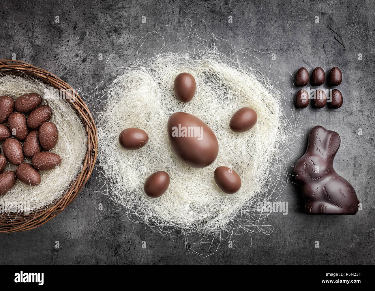 Chocolate Easter eggs in a nest on rustic background Stock Photo - Alamy