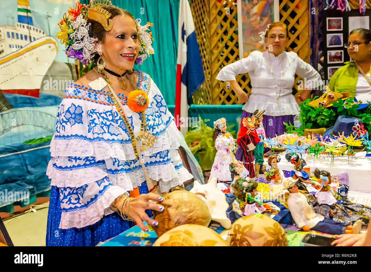 A Panamanian woman sells souvenirs at the 34th annual Mobile International Festival, Nov. 17, 2018, in Mobile, Alabama. The festival featured exhibits Stock Photo