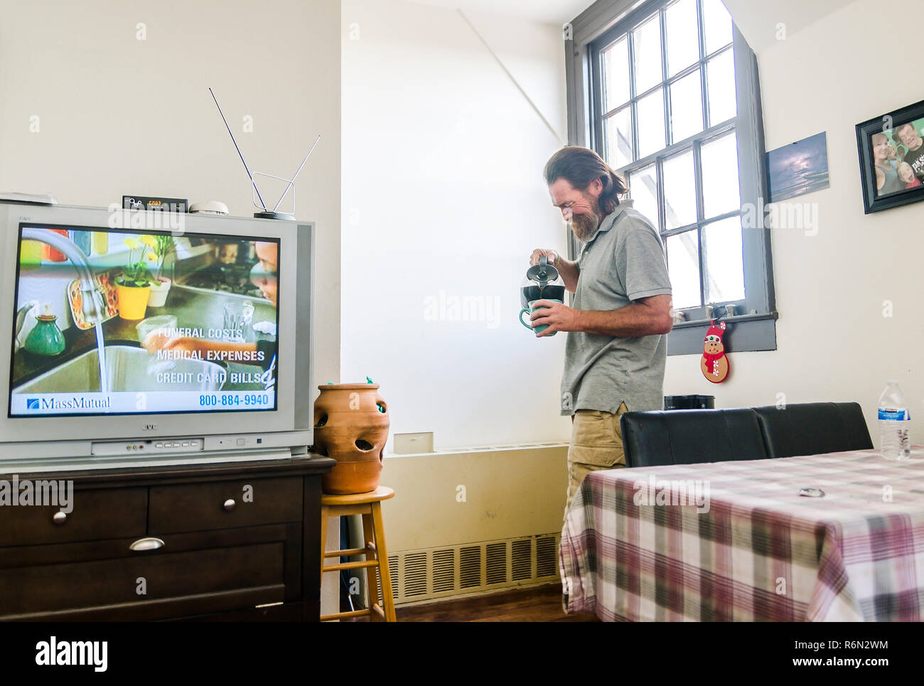 Formerly homeless veteran Darren Dalpiaz relaxes in his new apartment, Nov. 12, 2015, in New Orleans, Louisiana. Stock Photo