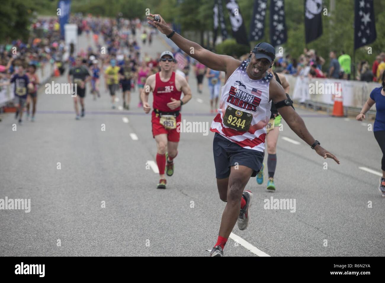 Leodis Smith finishes the final stretch of the Devil Dog Double portion of the 10th Annual Marine Corps Historic Half (MCHH), the 18.1-mile route from the Fredericksburg Expo Center into the historic downtown areas of Fredericksburg, Va., May 21, 2017. The MCHH attracts over 8,000 participants and features the Marine Corps Semper 5ive and the Devil Dog Double. Stock Photo