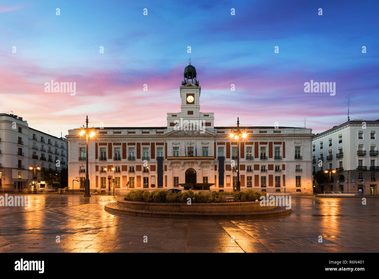 Puerta del Sol square is the main public space in Madrid. In the middle of  the square is located the office of the President of the Community of Madri  Stock Photo -