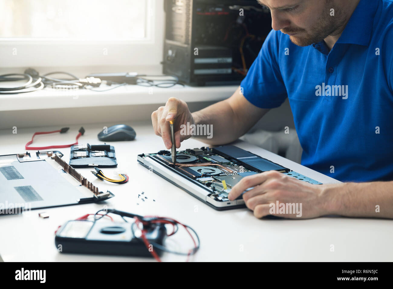 Computer Repair Service Technician Repairing Broken Laptop In Office Stock Photo Alamy