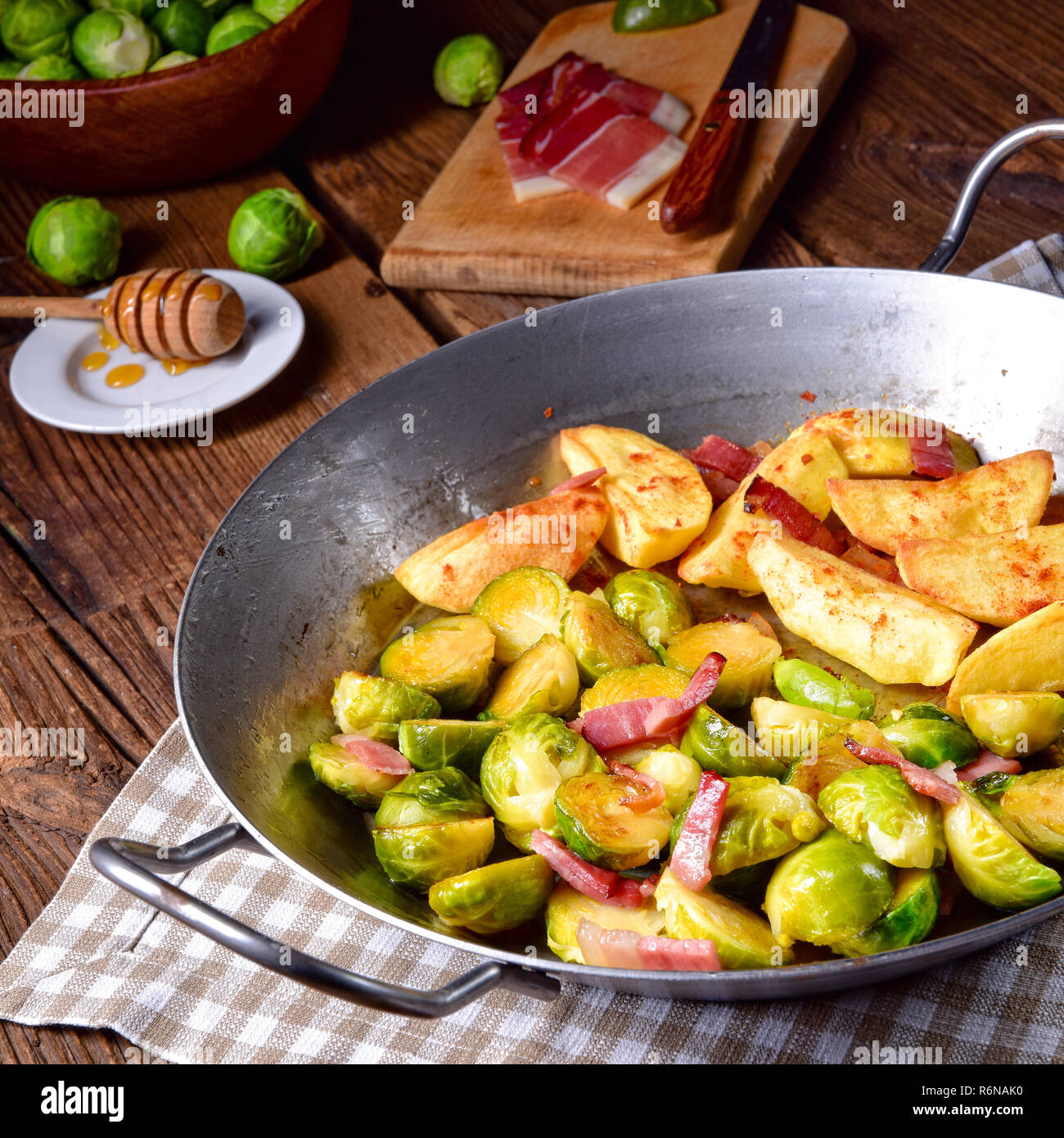 brussels sprouts with ham,honey and roasted potatoes Stock Photo Alamy