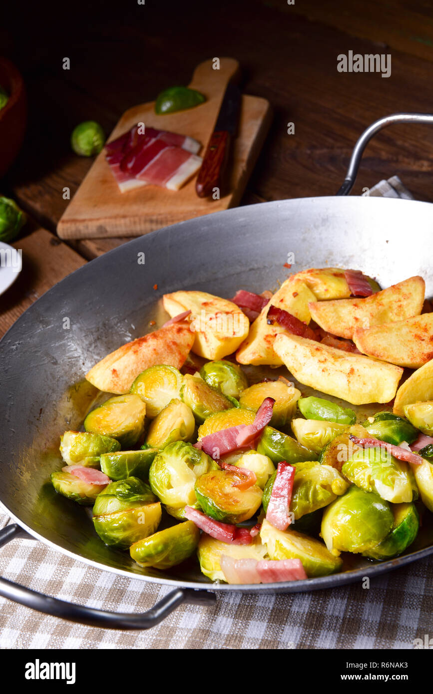 brussels sprouts with ham,honey and roasted potatoes Stock Photo Alamy