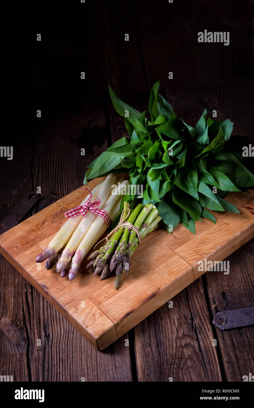 bear's garlic with white and green asparagus Stock Photo