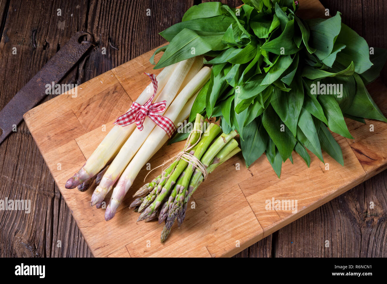bear's garlic with white and green asparagus Stock Photo