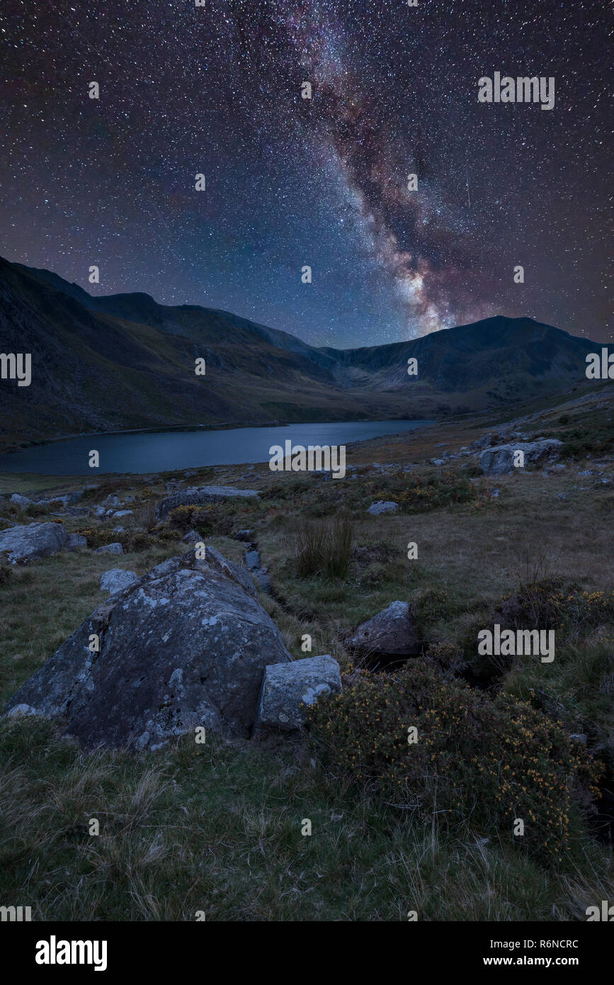 Stunning vibrant Milky Way composite image over Beautiful landscape ...