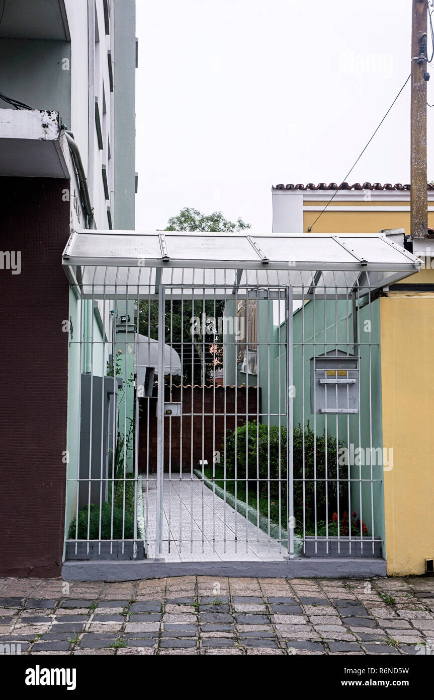 entrance apartament security gate sidewalk mailbox Brazil Stock Photo