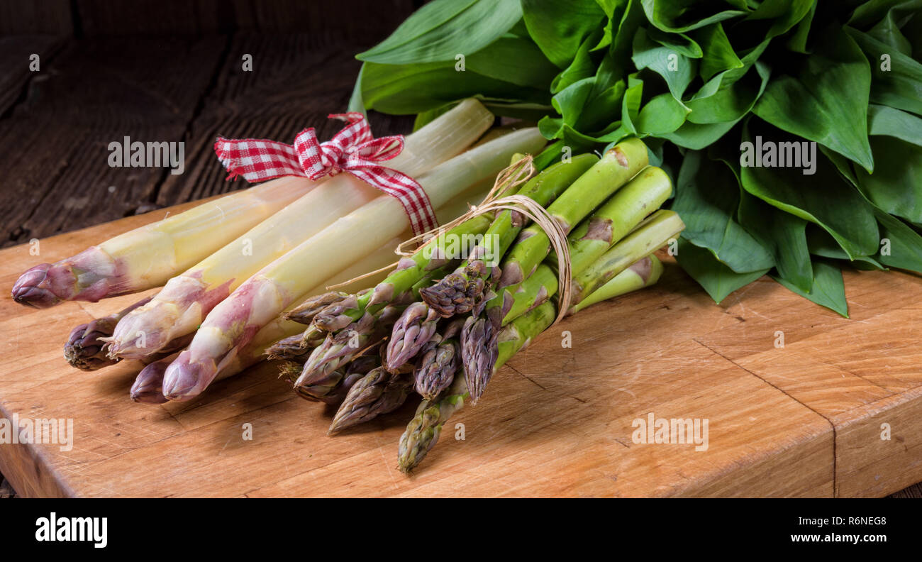 bear's garlic with white and green asparagus Stock Photo