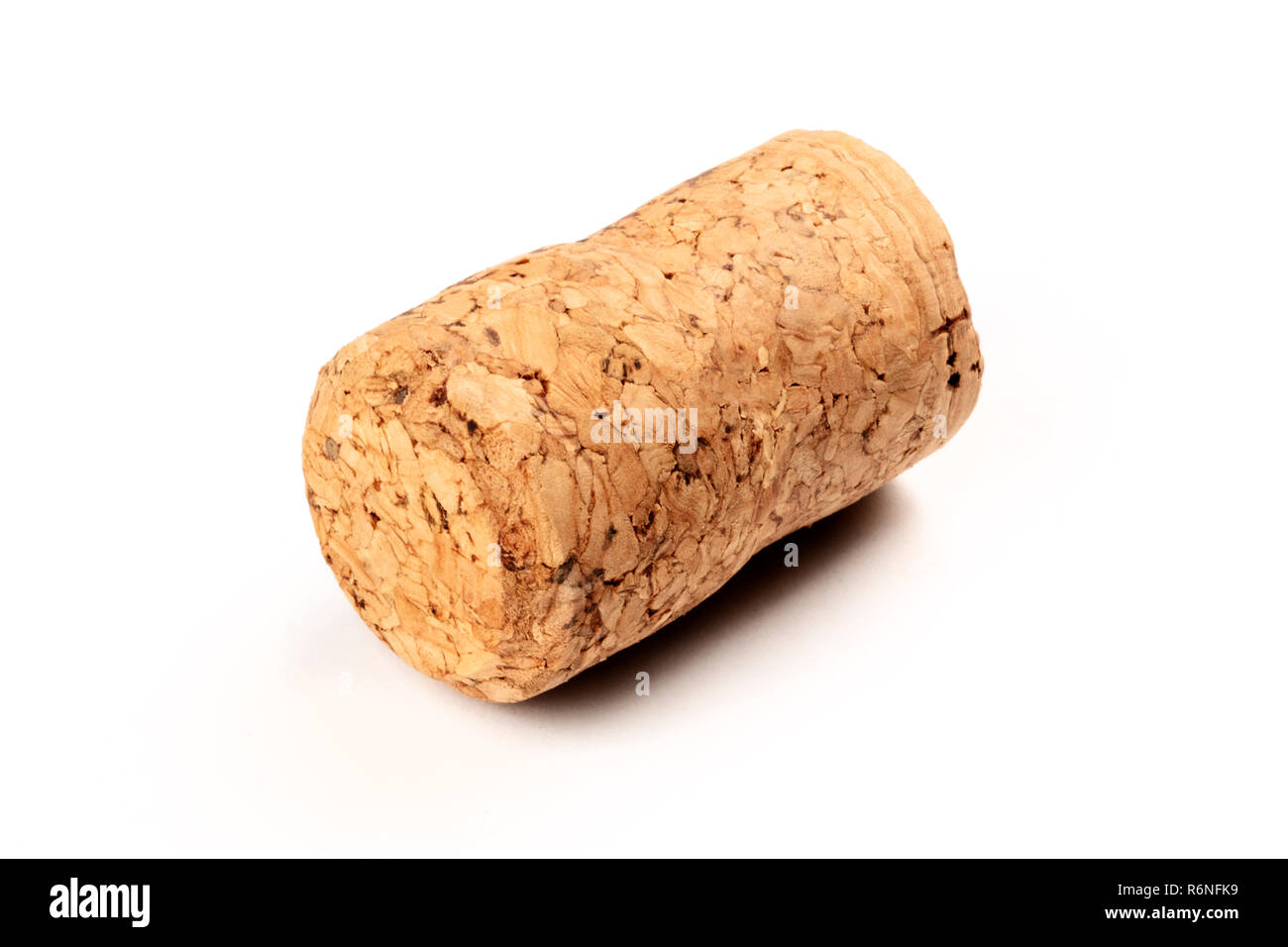A closeup photo of a champagne cork on a white background with copy space Stock Photo
