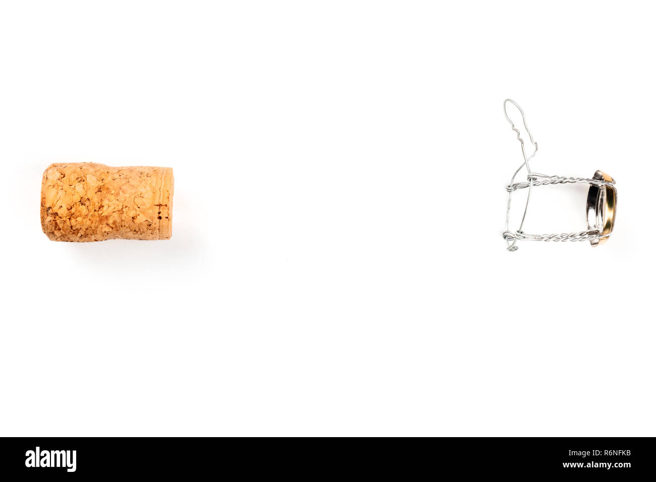 A photo of a champagne cork and closure, shot from the top on a white background with a place for text Stock Photo