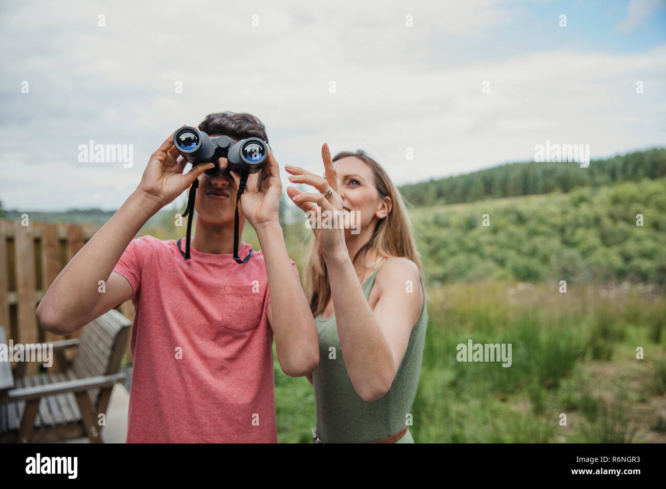 Looking Through Binoculars Stock Photo