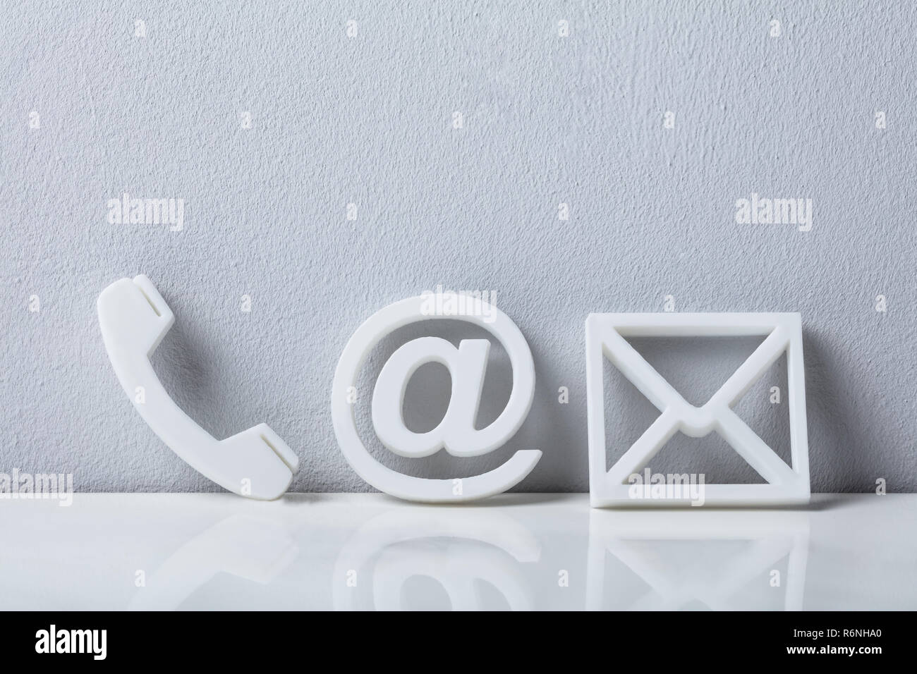 Close-up Of A Phone, Email and Post Icons Stock Photo