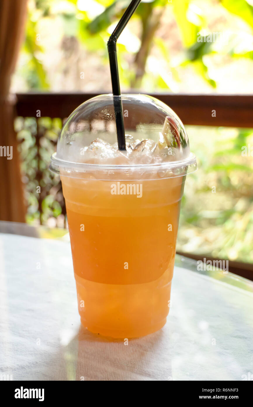 Fresh ice tea in plastic cup Stock Photo - Alamy