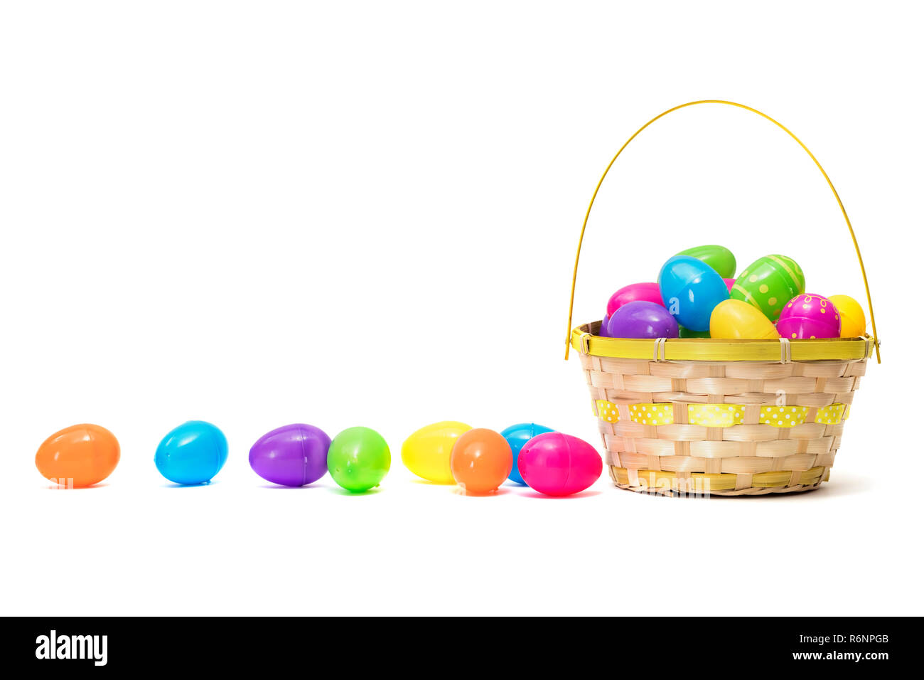 Easter eggs in basket isolated on white background Stock Photo - Alamy