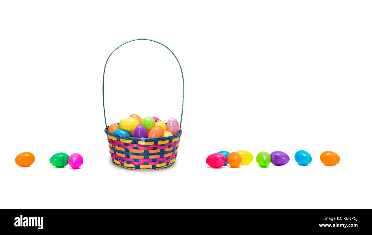 Easter eggs in basket isolated on white background Stock Photo - Alamy