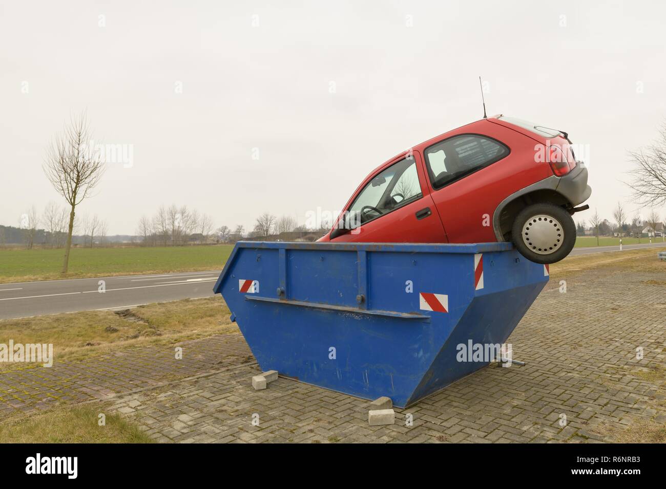 car in the scrap container Stock Photo