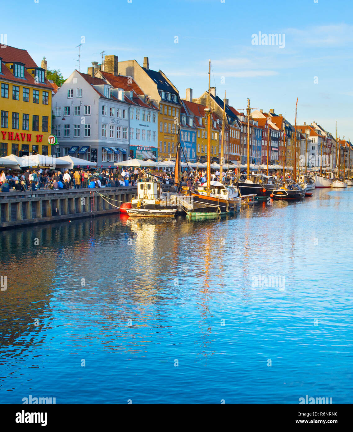 COPENHAGEN, DENMARK - JUNE 16, 2018: Tourists at Nyhavn district  - is one of the most famous landmark in Copenhagen Stock Photo