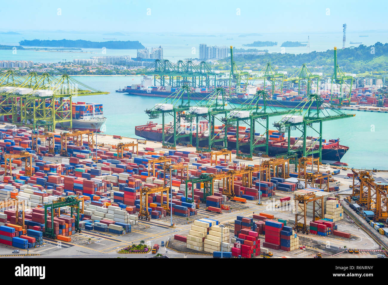 Aerial view of cargo ships in Singapore industrial port harbor by pier