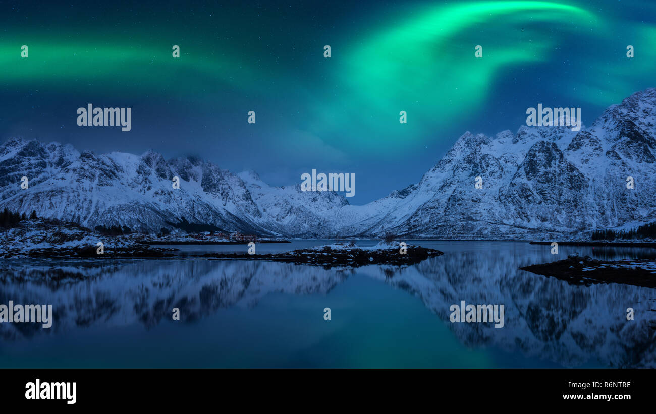 Large panorama, scenic view of Northern lights, Aurora borealis, Lofoten islands, Norway. Amazing night winter landscape Stock Photo