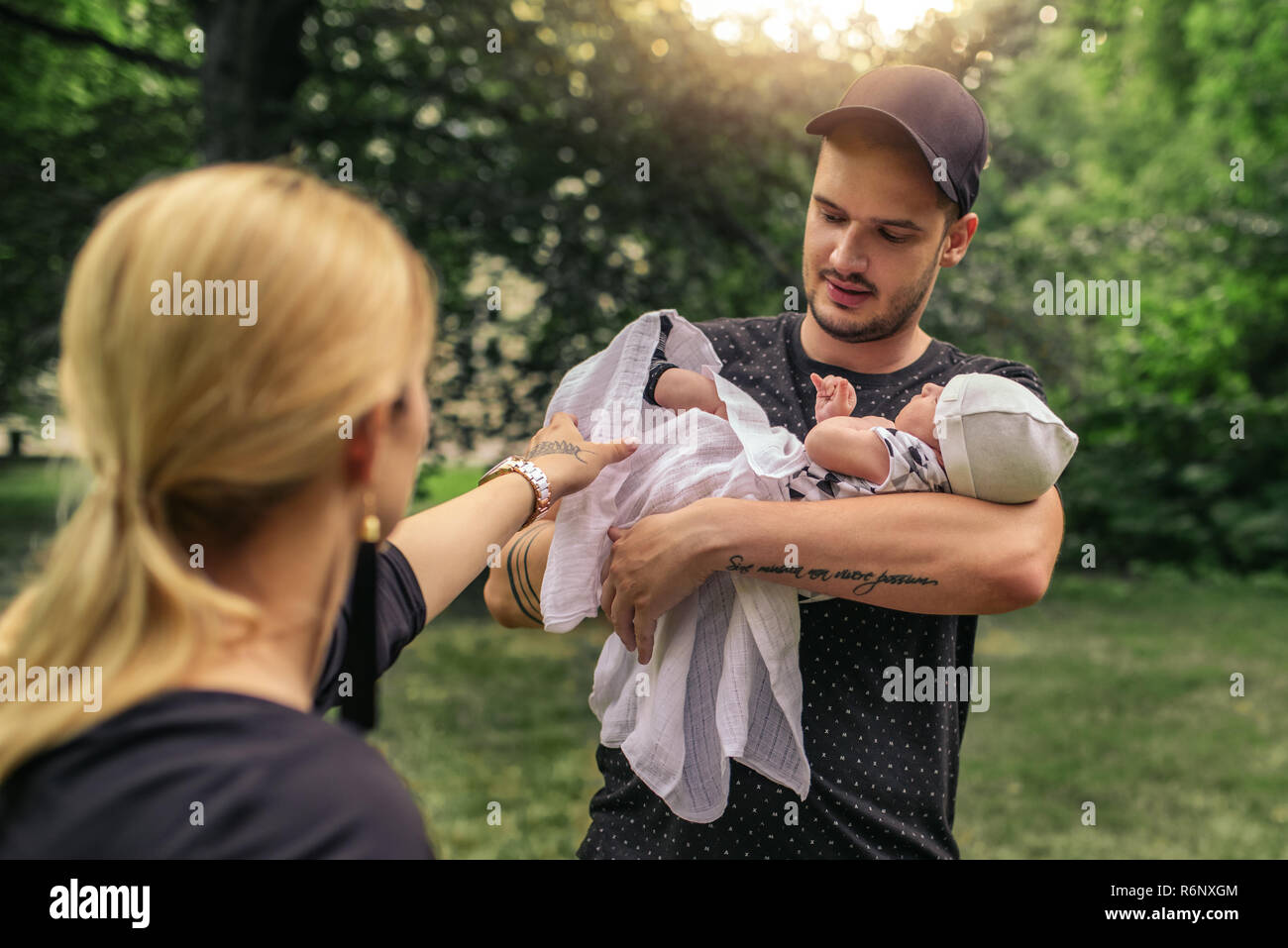 Loving parents enjoying a day outside with their baby boy Stock Photo