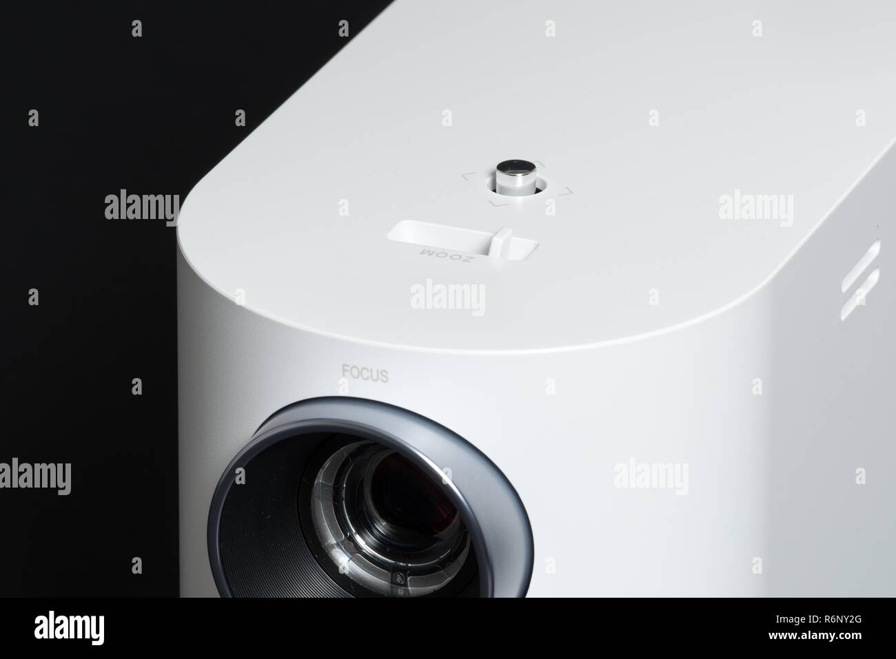 Stylish mini home cinema LED projector, lightweight tech gadget Stock Photo