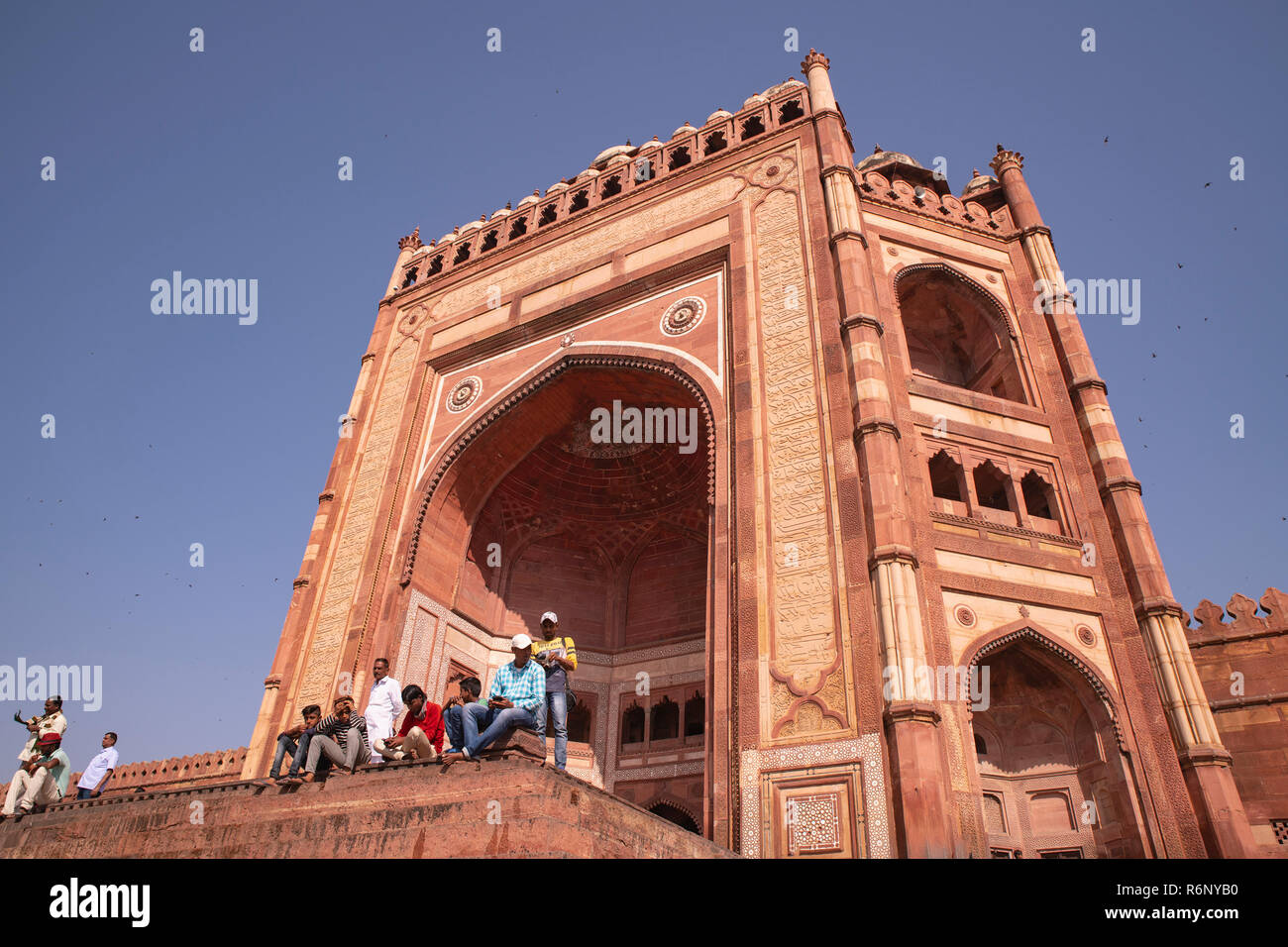 Indian,tourists,resting,on,stairs,East gate,Buland Darwaja,Fateh pur sikri,Agra, U.P.,India. Stock Photo