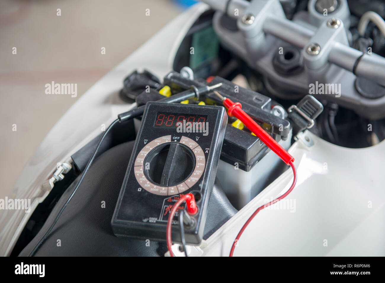 check if the motorcycle battery with multimeter Stock Photo Alamy