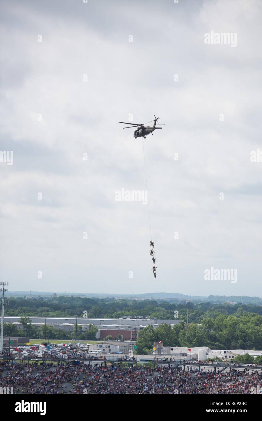 Soldiers with the 101st Airborne Division conduct a SPIES and FRIES aerial demonstration during the pre-race events at the Indy 500 on May 28, 2017. Stock Photo