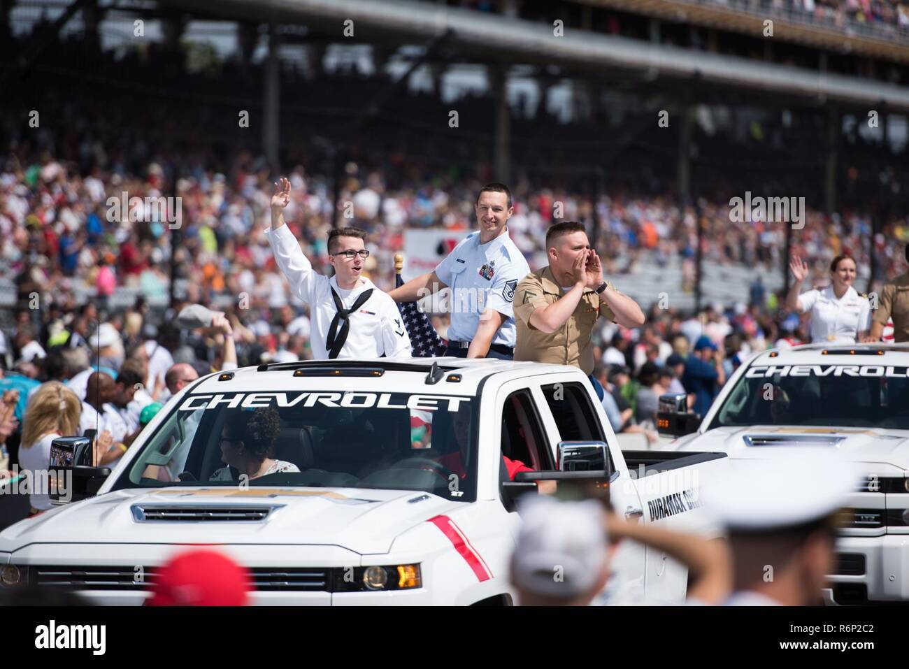 Service members from across the armed forces participate in the 'Chevy Truck Lap' during the pre-race events at the Indy 500 on May 28, 2017. Stock Photo