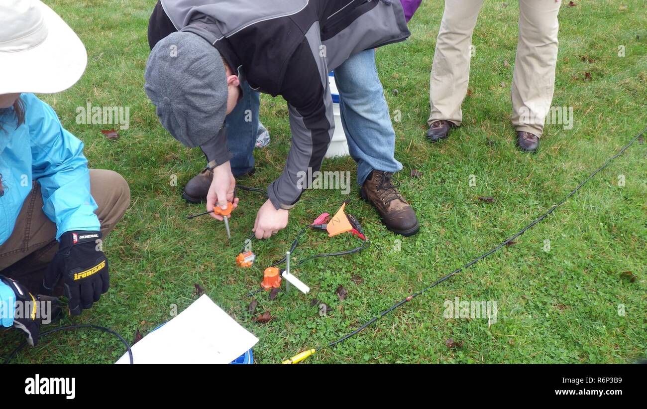Michael Muhelstein emplaces geophones, while Michelle, PhD. Swearengin and Alanna Lester look on