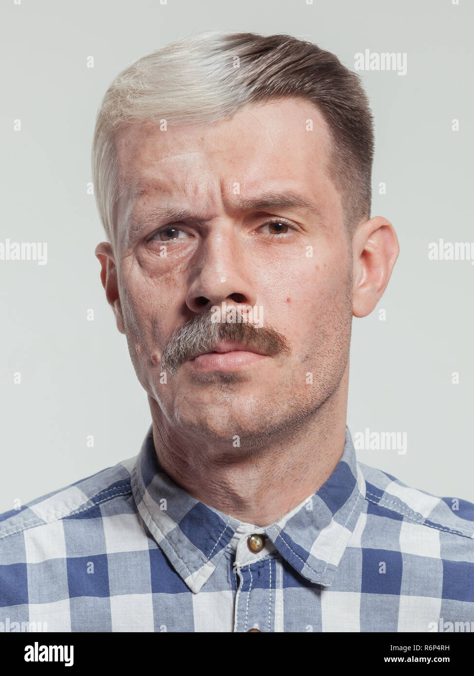 Collage of two portraits of the same old man and young man. Face