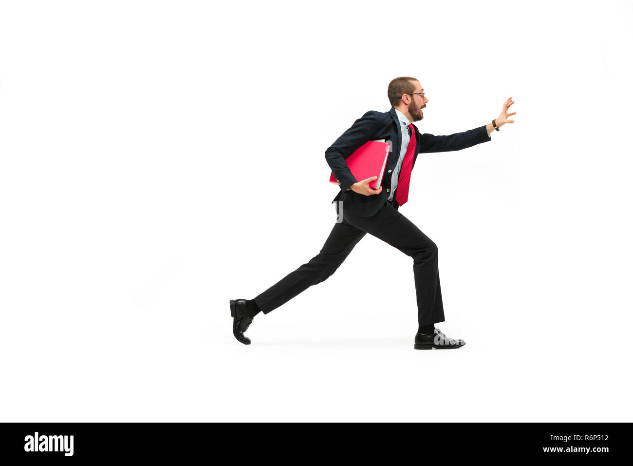 Businessman running with a folder on white background Stock Photo