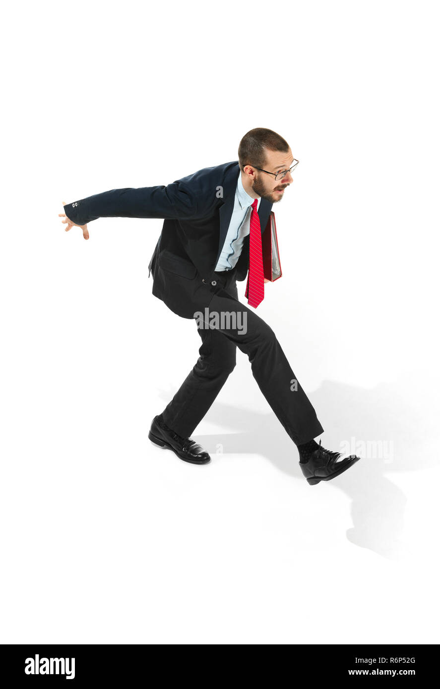 Businessman running with a folder on white background Stock Photo