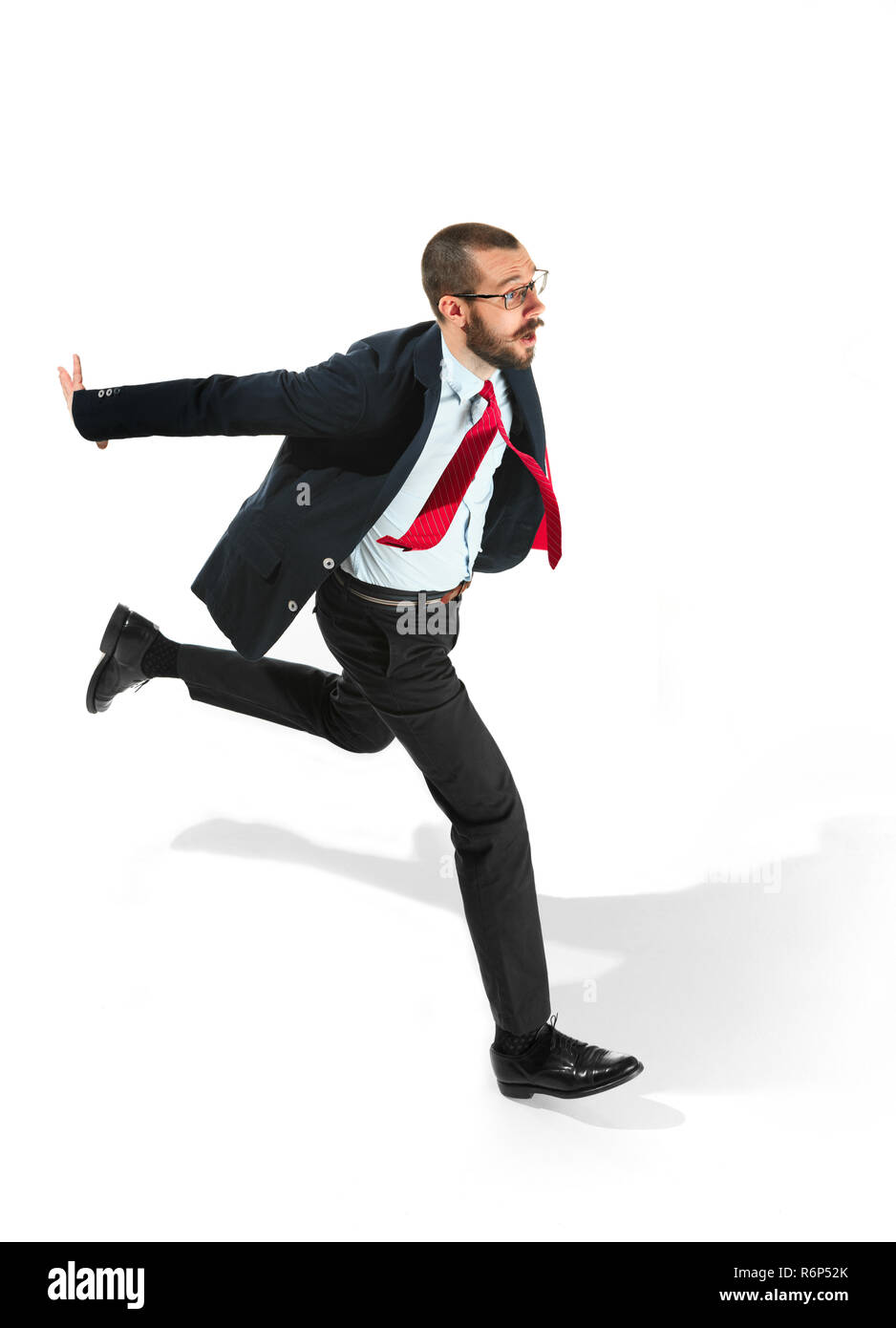 Businessman running with a folder on white background Stock Photo